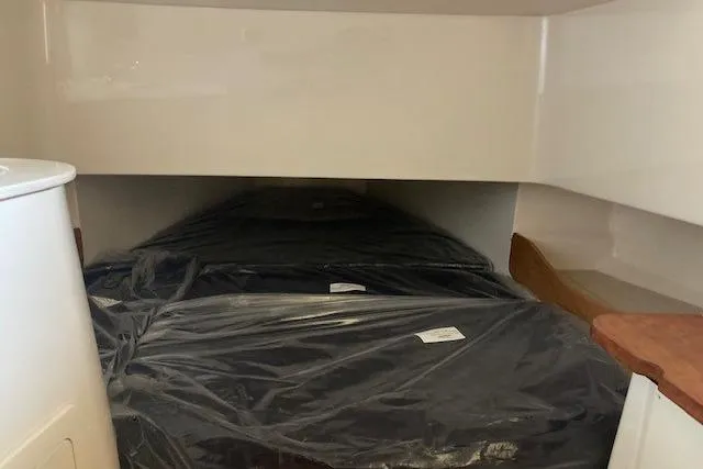 Slide: The Image of 2026 Grady-White Canyon 336 cabin interior with covered seating area. - 16
