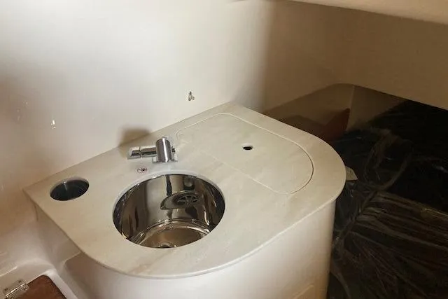 Slide: The Image of 2026 Grady-White Canyon 336 boat interior sink and countertop detail. - 17
