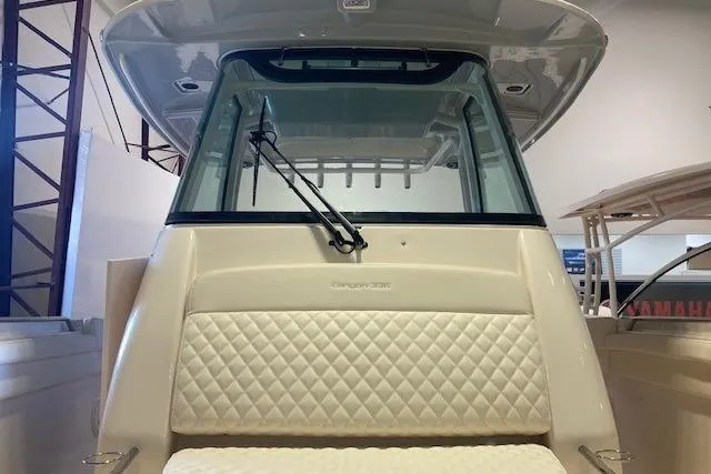 Slide: The Image of 2026 Grady-White Canyon 336 boat interior with quilted seating and windshield. - 24