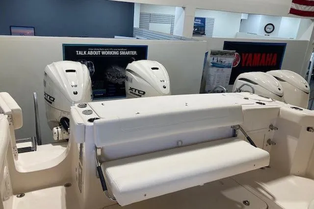 Slide: The Image of 2026 Grady-White Canyon 336 boat with Yamaha V8 engines in showroom. - 4