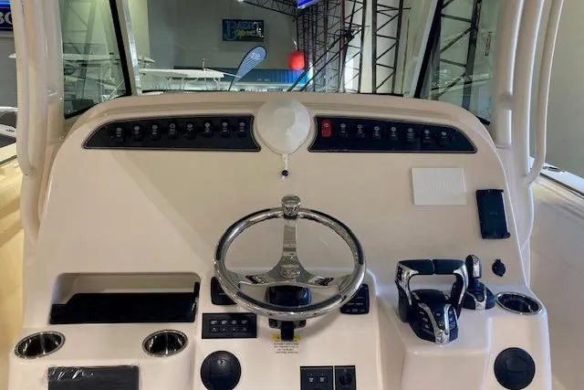 Slide: The Image of 2026 Grady-White Canyon 336 helm with steering wheel and control panel. - 7