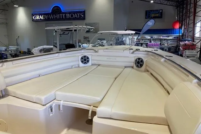 Slide: The Image of 2026 Grady-White Canyon 336 boat interior with spacious seating in showroom. - 9