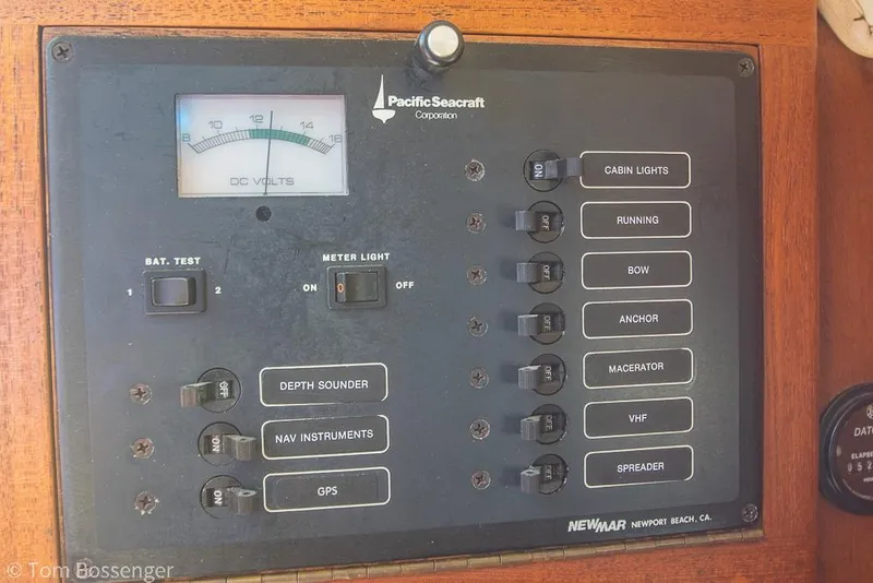 Slide: The Image of Control panel of a 1993 Pacific Seacraft Flicka 20 sailboat with various switches and voltmeter. - 18
