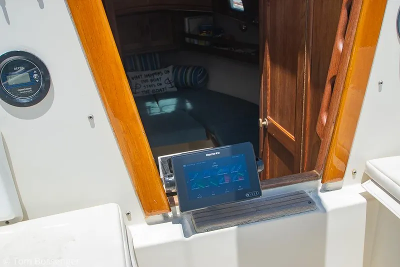 Slide: The Image of Interior view of 1993 Pacific Seacraft Flicka 20 sailboat with navigation equipment. - 20