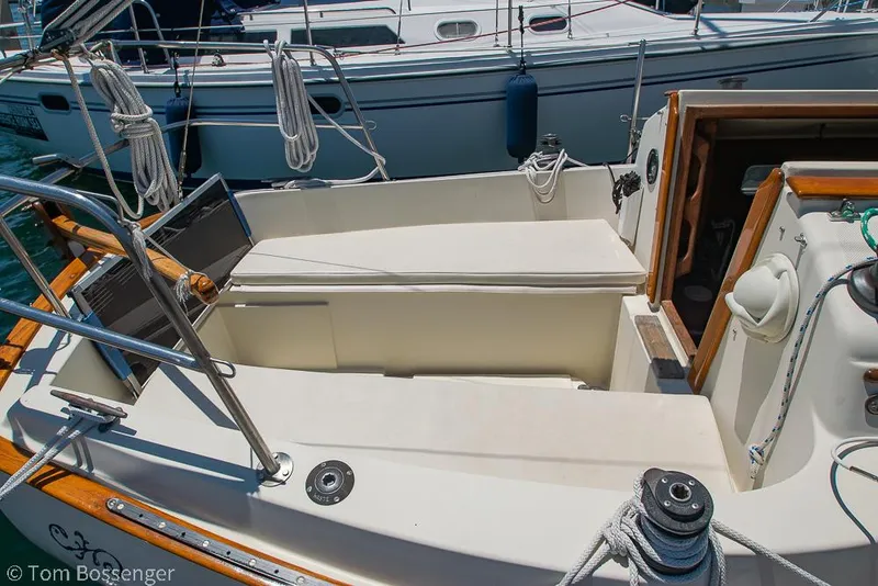 Slide: The Image of Cockpit of 1993 Pacific Seacraft Flicka 20 sailboat, featuring seating and nautical equipment. - 22