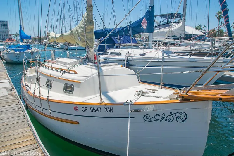 Slide: The Image of Sailboat Pacific Seacraft Flicka 20, 1993 model, docked in a marina under clear skies. - 30