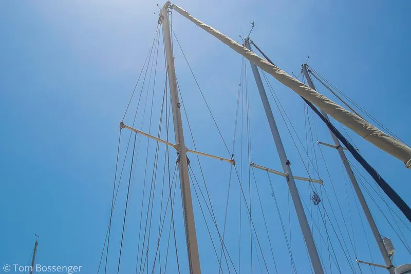 Slide: The Image of Masts of a 1993 Pacific Seacraft Flicka 20 sailboat against a clear blue sky. - 32
