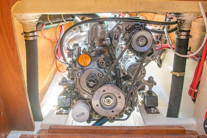 Slide: The Image of Engine compartment of a 1993 Pacific Seacraft Flicka 20 sailboat, showcasing mechanical components. - 33