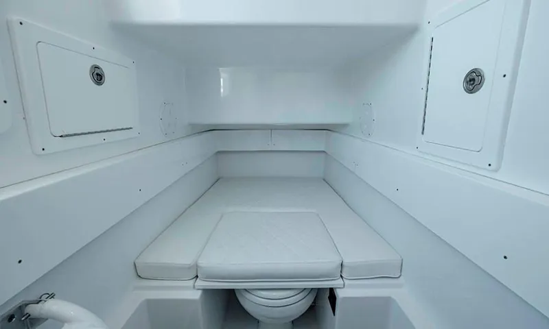 Slide: The Image of Interior of 2024 Onslow Bay 37 boat, featuring control panels and storage compartments. - 12