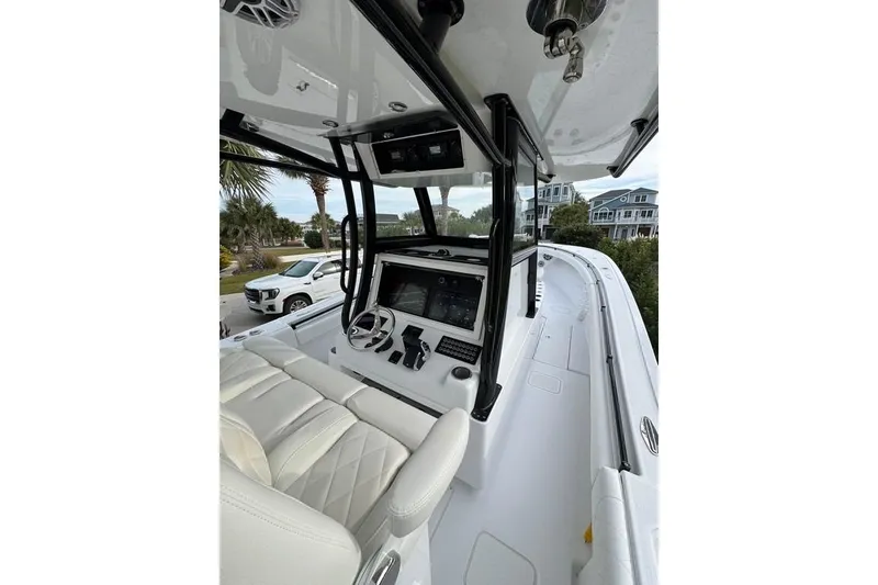 Slide: The Image of 2024 Onslow Bay 37 Tournament boat interior with modern helm and seating. - 19