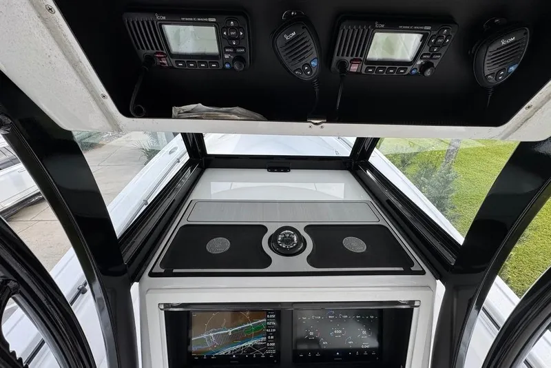 Slide: The Image of 2024 Onslow Bay 37 Tournament boat dashboard with navigation and communication equipment. - 24