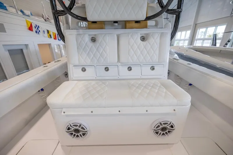 Slide: The Image of 2024 Onslow Bay 37 Tournament boat interior with white quilted seating and storage. - 27