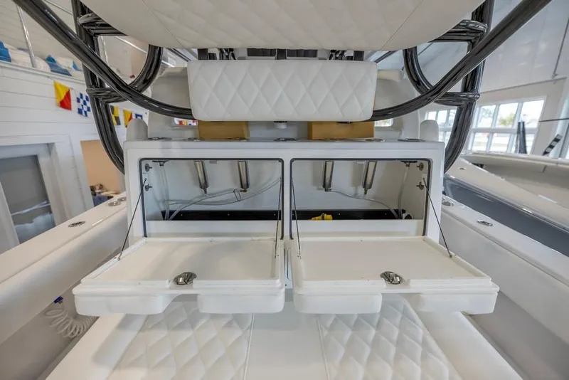 Slide: The Image of 2024 Onslow Bay 37 Tournament boat interior with open storage compartments. - 29