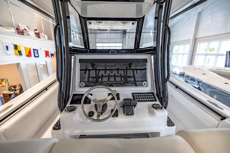Slide: The Image of 2024 Onslow Bay 37 Tournament boat helm with modern controls and steering wheel. - 31