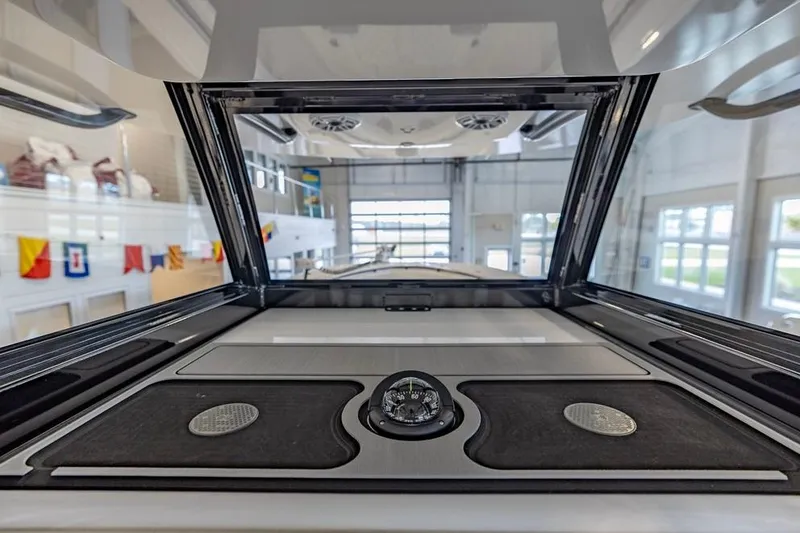 Slide: The Image of 2024 Onslow Bay 37 Tournament boat interior with modern dashboard and navigation instruments. - 34
