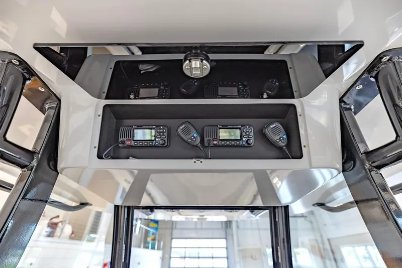 Slide: The Image of 2024 Onslow Bay 37 Tournament boat console with advanced communication equipment. - 35