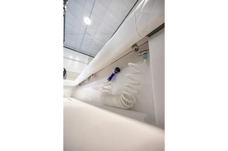 Slide: The Image of 2024 Onslow Bay 37 Tournament boat interior detail with coiled hose attachment. - 36