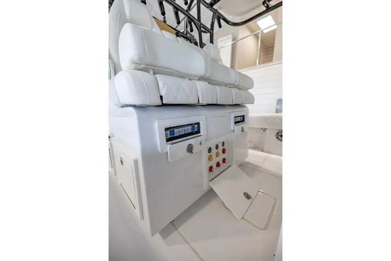 Slide: The Image of 2024 Onslow Bay 37 Tournament boat interior with white seating and control panel. - 38