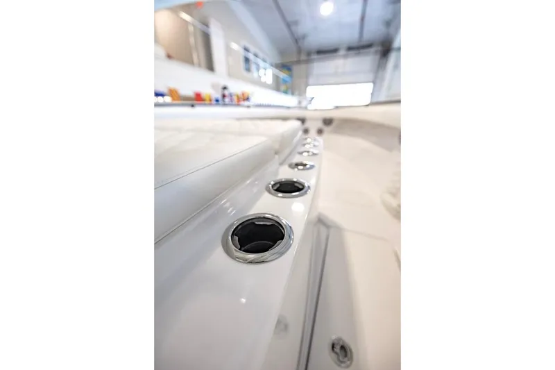 Slide: The Image of 2024 Onslow Bay 37 Tournament boat interior with rod holders in a sleek design. - 42