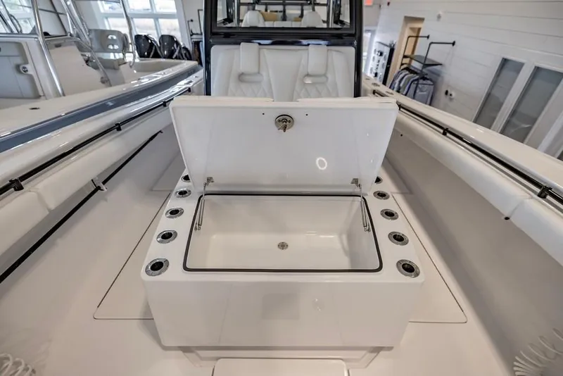 Slide: The Image of 2024 Onslow Bay 37 Tournament boat with open storage compartment in showroom. - 45