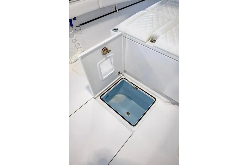 Slide: The Image of 2024 Onslow Bay 37 Tournament boat interior with open storage compartment. - 46