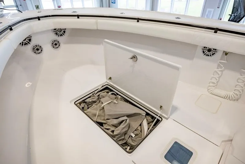 Slide: The Image of 2024 Onslow Bay 37 Tournament boat interior with storage compartment open. - 47