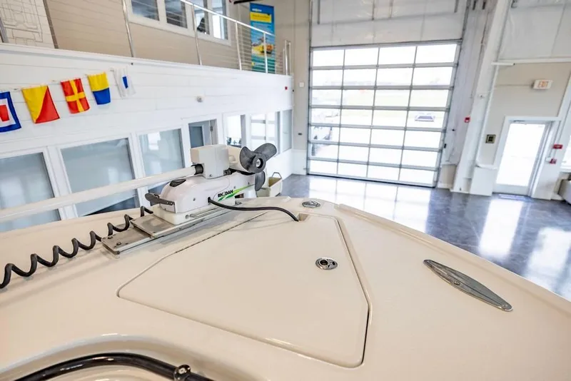 Slide: The Image of 2024 Onslow Bay 37 Tournament boat in showroom with nautical flags displayed. - 49