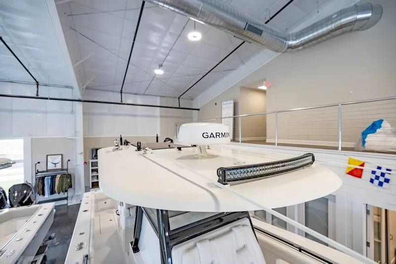 Slide: The Image of 2024 Onslow Bay 37 Tournament boat with Garmin radar in a showroom. - 51