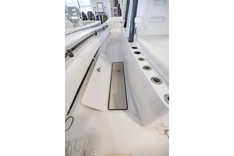 Slide: The Image of 2024 Onslow Bay 37 Tournament boat interior with rod holders and storage compartment. - 52