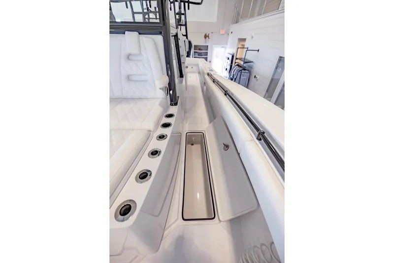 Slide: The Image of 2024 Onslow Bay 37 Tournament boat interior with seating and storage compartments. - 53
