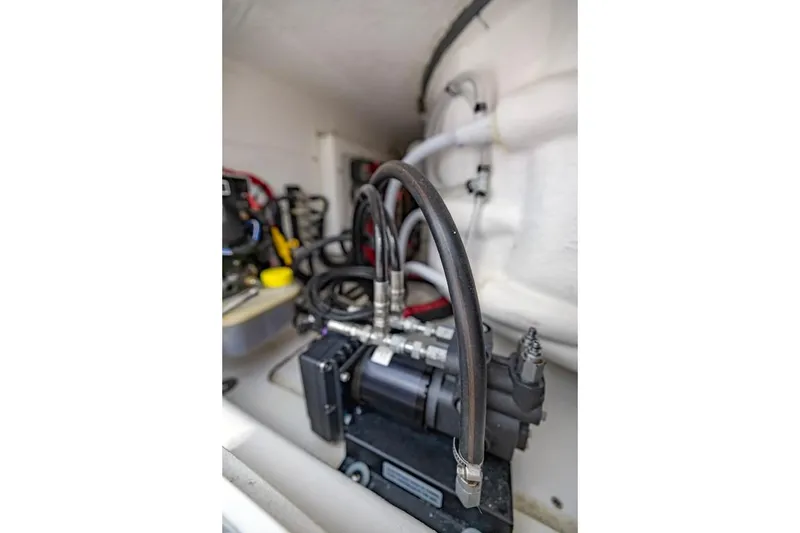 Slide: The Image of Engine compartment of 2024 Onslow Bay 37 Tournament boat, showcasing mechanical components. - 54