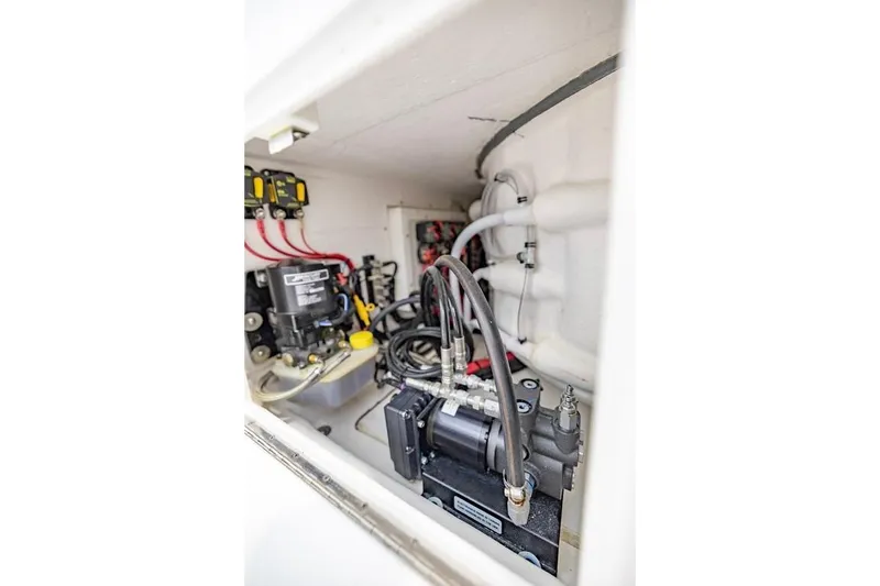 Slide: The Image of 2024 Onslow Bay 37 Tournament boat engine compartment with wiring and hydraulic components. - 55