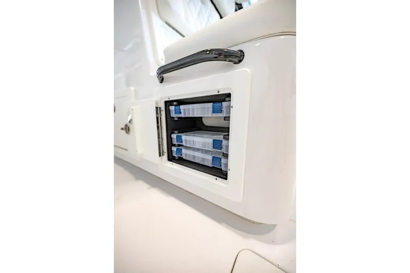 Slide: The Image of Storage compartment on 2024 Onslow Bay 37 Tournament boat, featuring organized tackle boxes. - 57