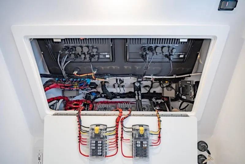 Slide: The Image of Electrical panel of 2024 Onslow Bay 37 Tournament boat, showcasing wiring and components. - 60