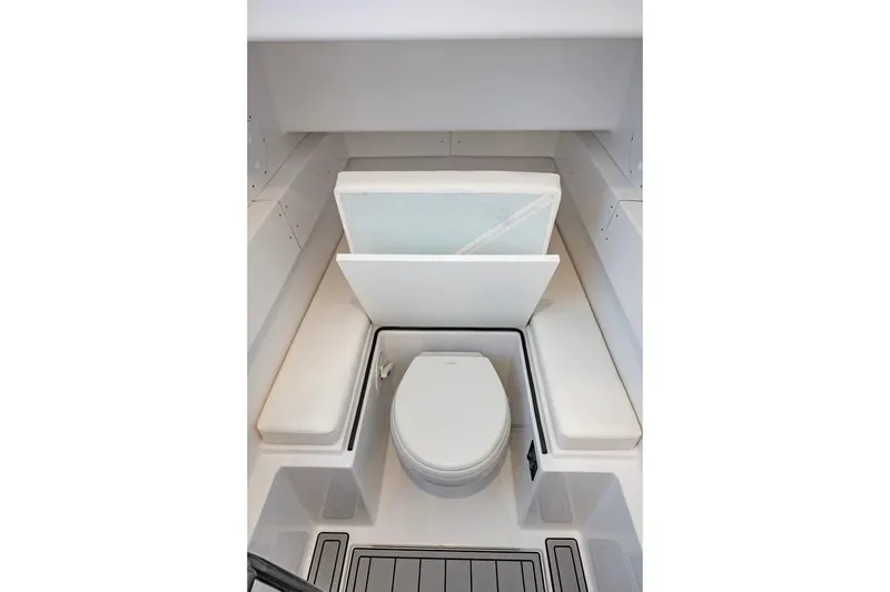 Slide: The Image of 2024 Onslow Bay 37 Tournament boat interior with seating and toilet. - 64