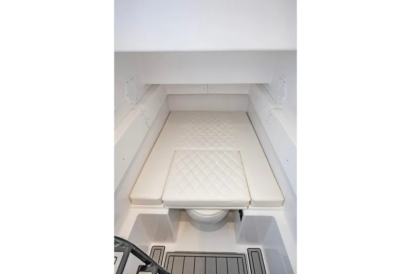 Slide: The Image of 2024 Onslow Bay 37 Tournament cabin interior with white cushioned seating. - 65