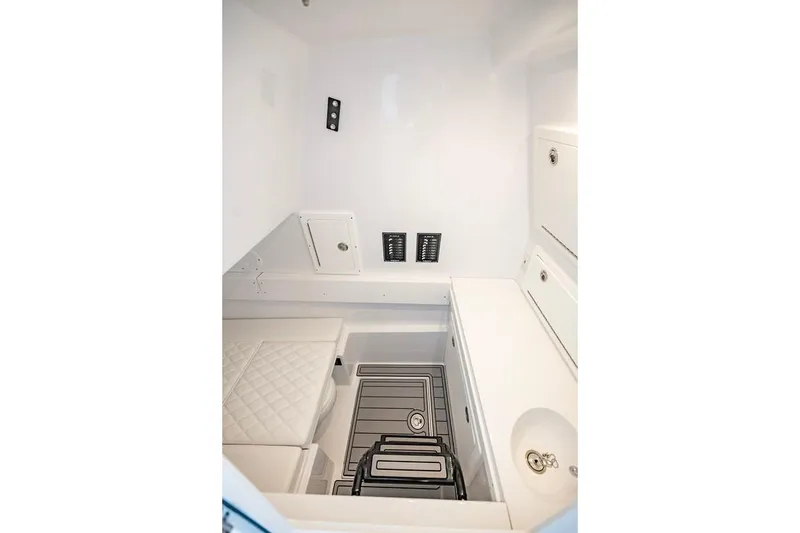 Slide: The Image of 2024 Onslow Bay 37 Tournament boat interior with white cabinetry and seating. - 66