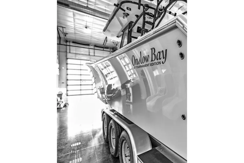 Slide: The Image of 2024 Onslow Bay 37 Tournament boat in a garage, side view. - 68