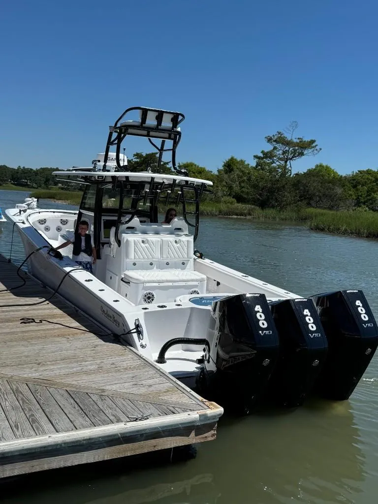 Slide: The Image of 2024 Onslow Bay 37 boat docked at marina under clear blue sky. - 8
