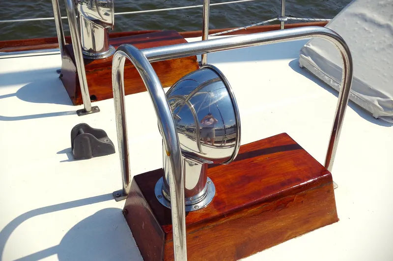 Slide: The Image of 1983 Bristol 41.1 yacht deck with polished metal and wooden fixtures. - 14