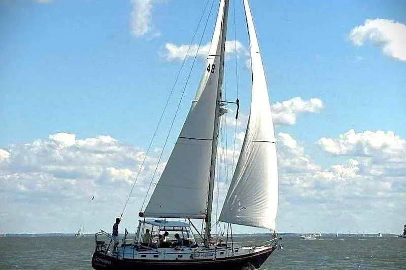 Slide: The Image of Sailboat on open water, Bristol 41.1 model, 1983, under clear blue sky. - 18