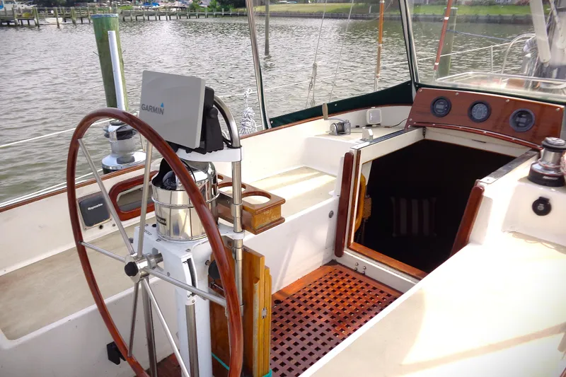 Slide: The Image of Cockpit of 1983 Bristol 41.1 sailboat with wooden wheel and Garmin navigation system. - 12
