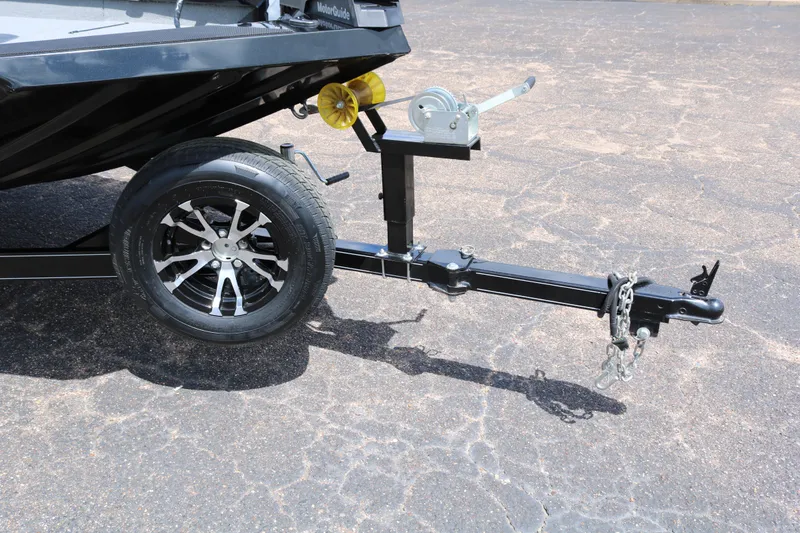 Slide: The Image of Trailer hitch and wheel of 2020 Alumacraft Pro 185 boat on pavement. - 10