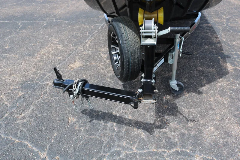 Slide: The Image of Trailer hitch and wheel of 2020 Alumacraft Pro 185 boat on asphalt. - 11