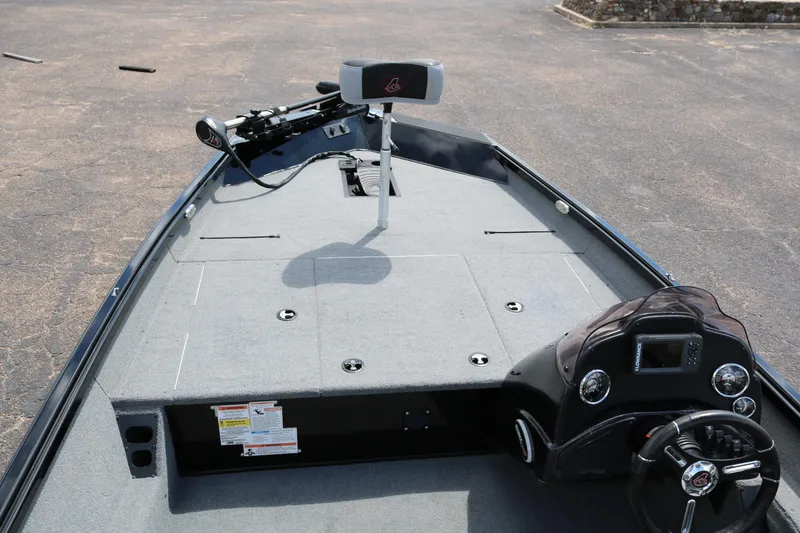 Slide: The Image of 2020 Alumacraft Pro 185 boat interior with steering wheel and control panel. - 12