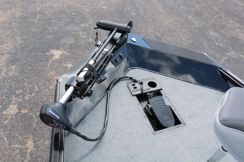 Slide: The Image of 2020 Alumacraft Pro 185 boat deck with trolling motor and foot pedal controls. - 13