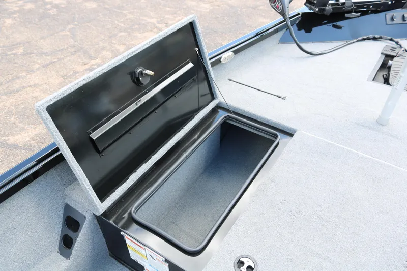 Slide: The Image of Open storage compartment on 2020 Alumacraft Pro 185 boat deck. - 16