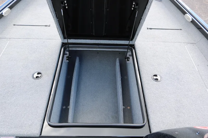 Slide: The Image of 2020 Alumacraft Pro 185 boat storage compartment with open lid, showcasing spacious interior. - 18