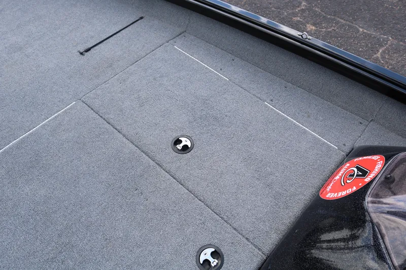 Slide: The Image of 2020 Alumacraft Pro 185 boat deck with storage compartments and fishing sticker. - 20