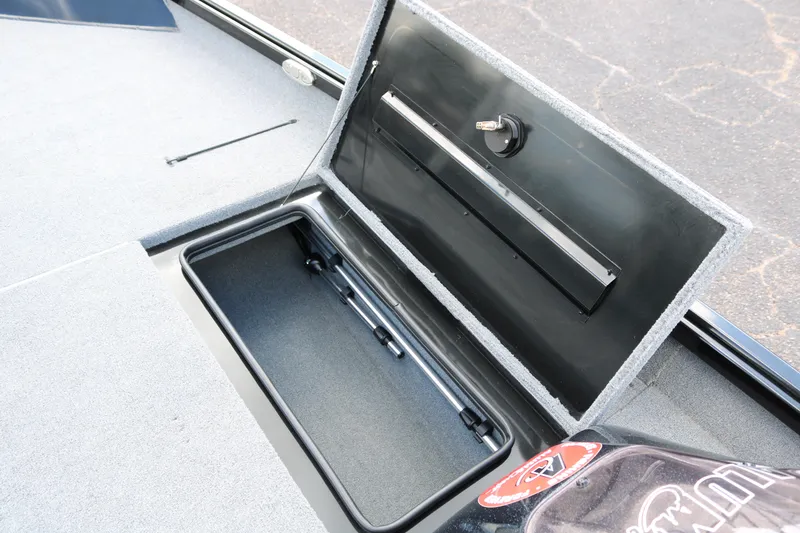 Slide: The Image of 2020 Alumacraft Pro 185 boat storage compartment open, showcasing interior space. - 21